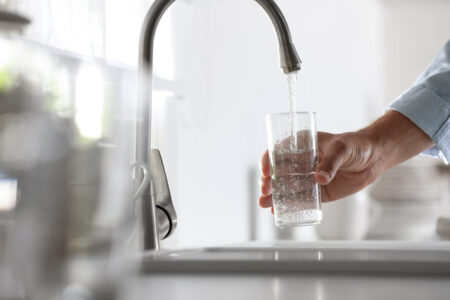 image of water faucet and glass